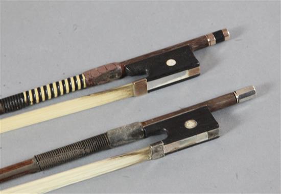 Two violin bows, one silver and the other gold mounted, unstamped,
